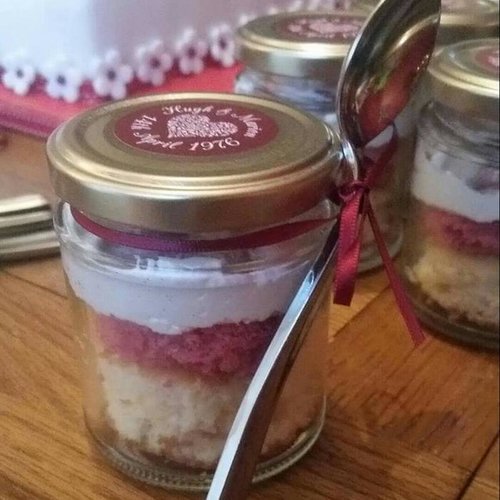 Anniversary jamjar cake. layered Sponge with attached spoon