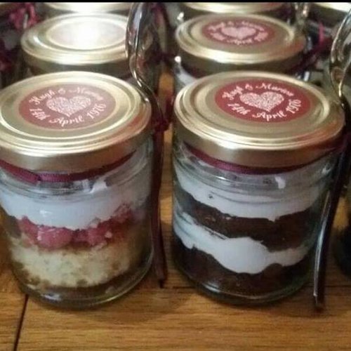 Anniversary mixed jamjar cakes. layered Sponge and chocolate fillings with attached spoon
